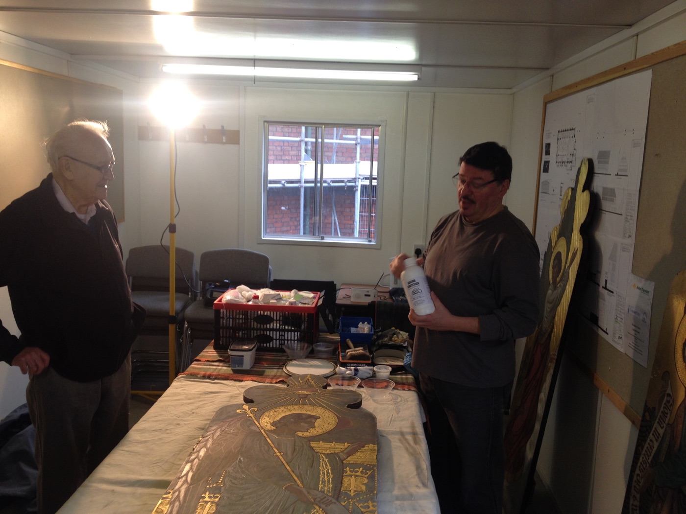 Silvano Cioci-Faux holding a conservation product while explaining the process to a visitor