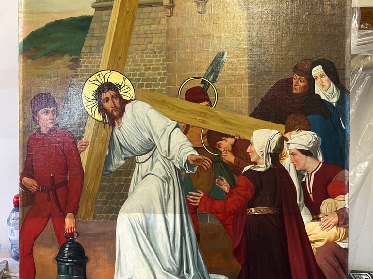 Varnish removal in progress on Christ Carrying the Cross panel painting