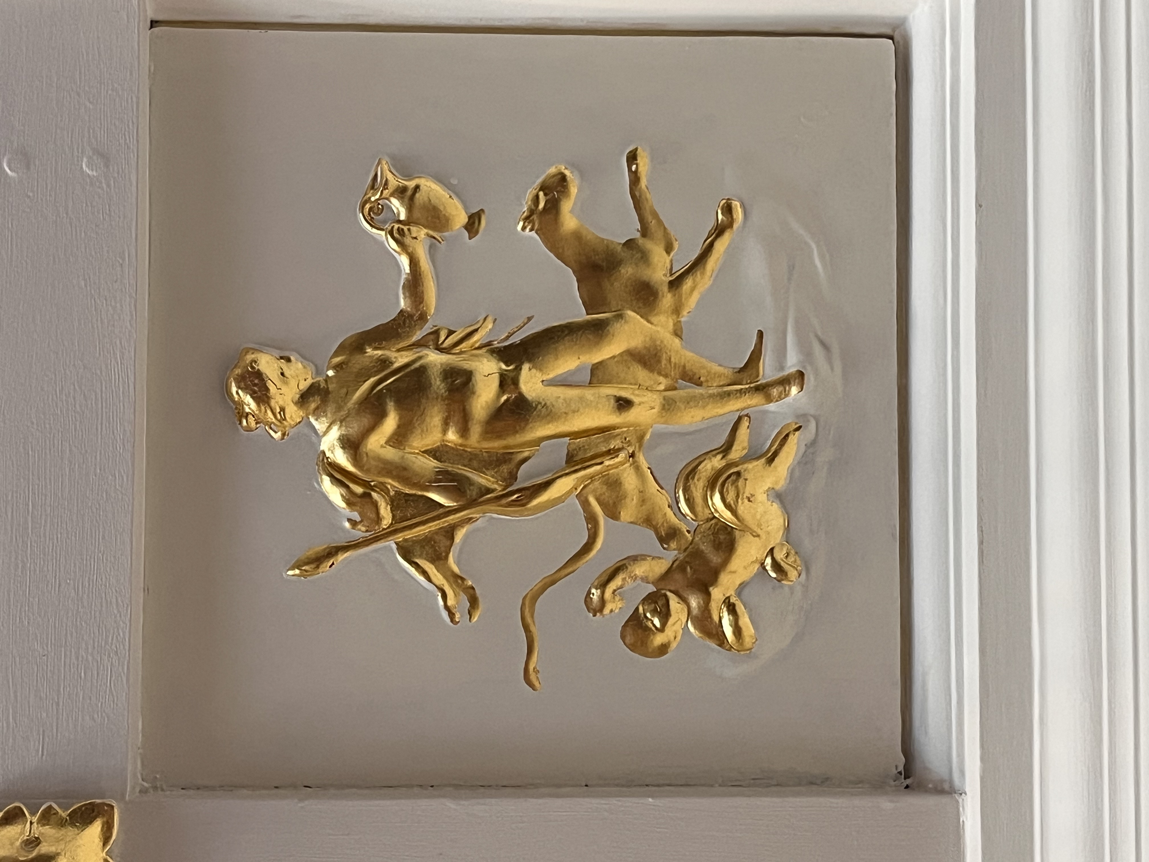 Gilding on ceiling plaque