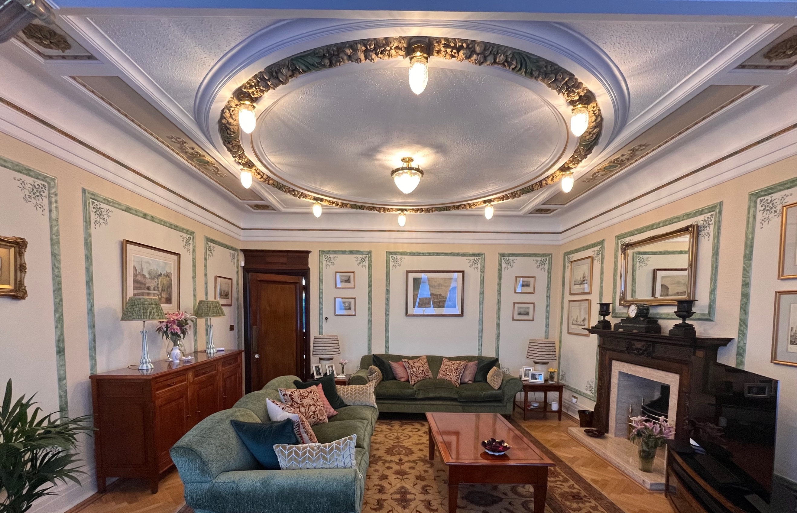 Victorian drawing room with hand-cut stencil panels and coffered ceiling