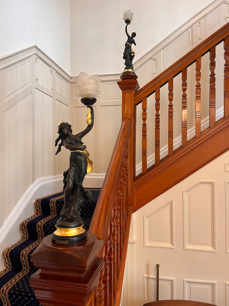 Gilded staircase ornament in a Victorian private home
