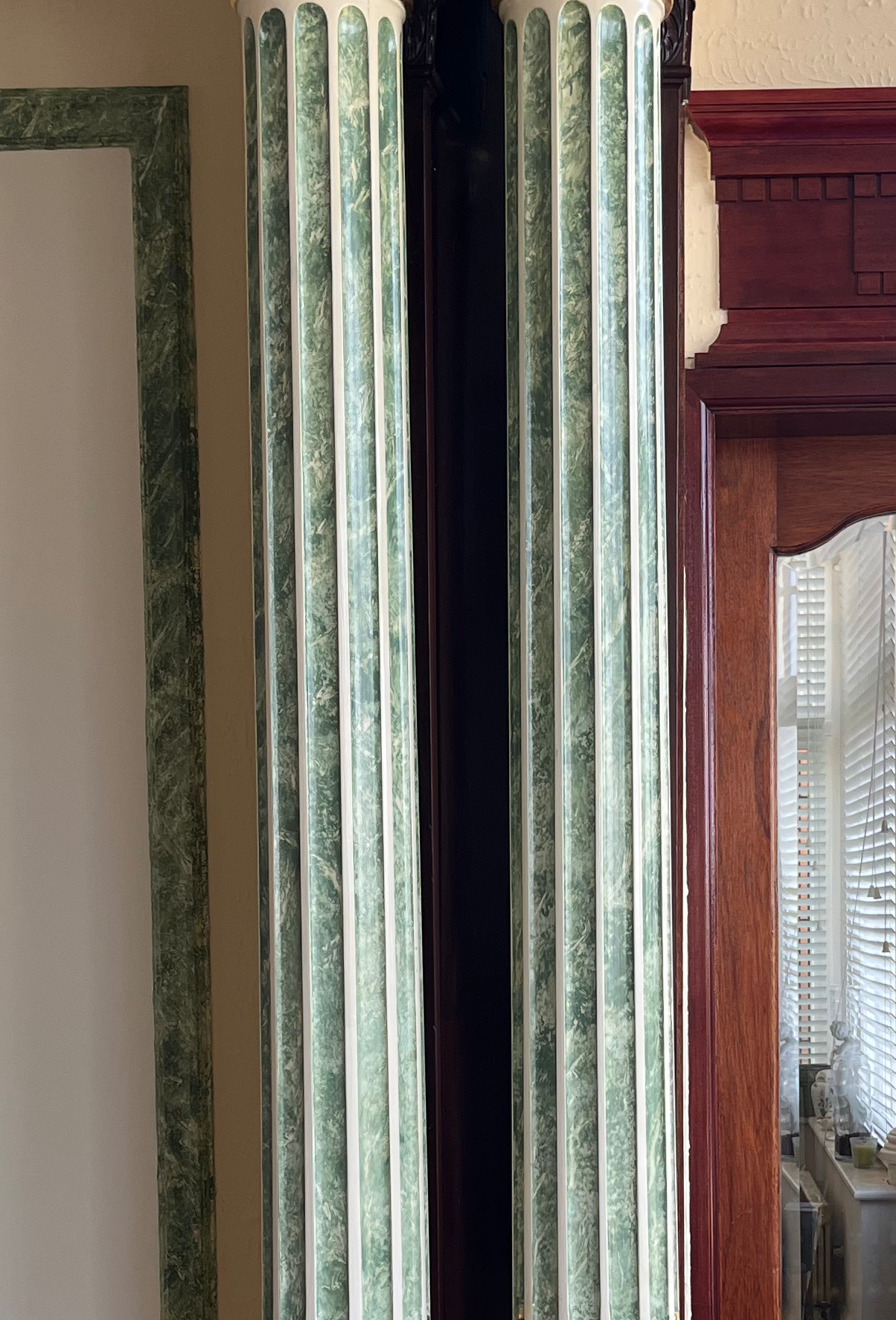 Faux marble and gilding on wooden columns