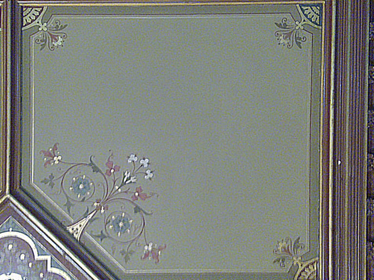 Conserved domino stencilled wall panel with floral motifs and gilt border at Werneth Hall, Oldham